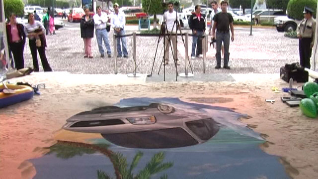 People looking at 3D street art for Ford in Mexico