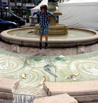 Illusion of a spilling fountain with fish